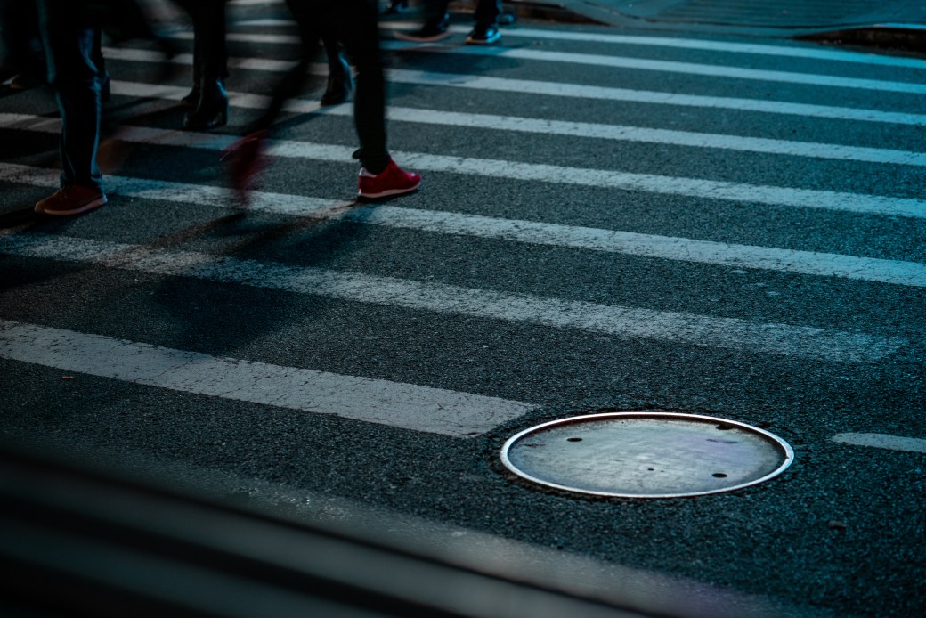 city-pedestrians-walking-at-night-and-a-sewer-cap_t20_YwGoG0