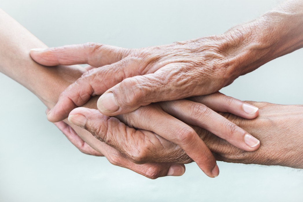hands-of-young-adults-and-older-women-on-a-light-background-adult-age-aged-aging-background-care_t20_N00aVE