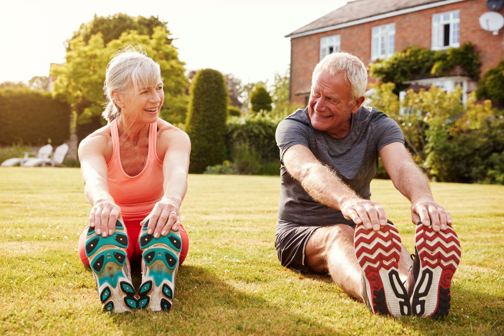 healthy-senior-couple-exercising-in-garden-togethe-2021-04-02-19-59-57-utc