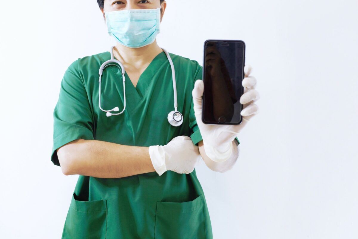 doctor-or-surgeon-using-a-smart-phone-with-copy-space-healthcare-and-medical-communication_t20_YNAKmO